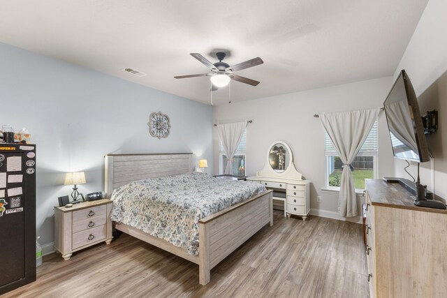 bedroom featuring ceiling fan and wood-type flooring