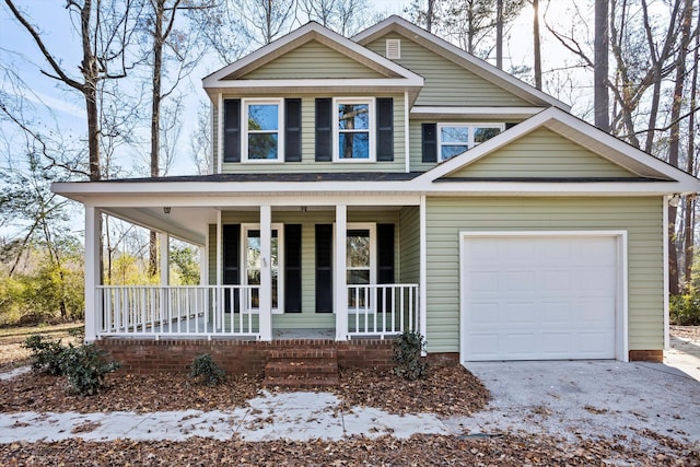 view of front of house with a porch and a garage