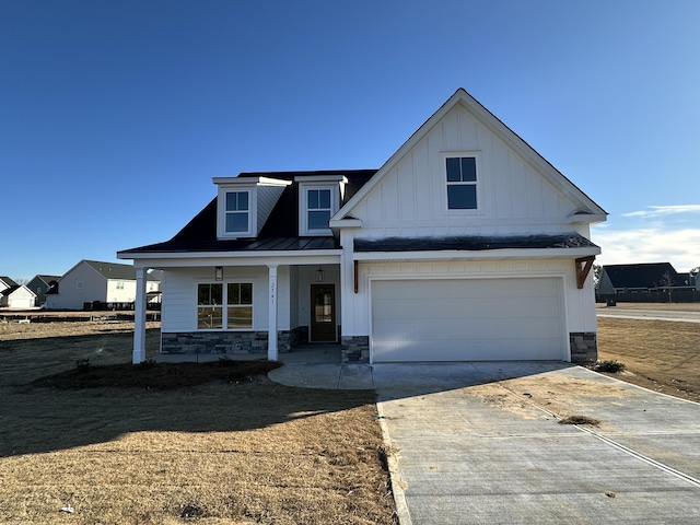 view of front of home with a garage and covered porch