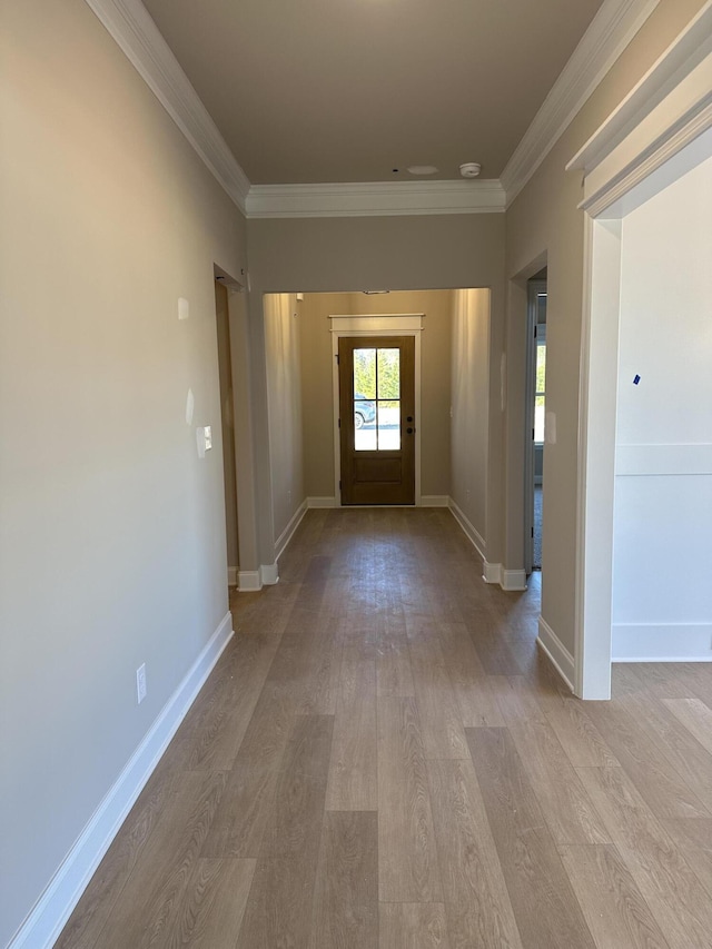 interior space featuring light hardwood / wood-style flooring and ornamental molding