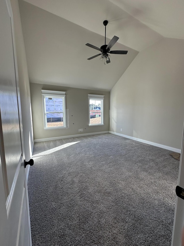 spare room featuring ceiling fan, lofted ceiling, and carpet floors