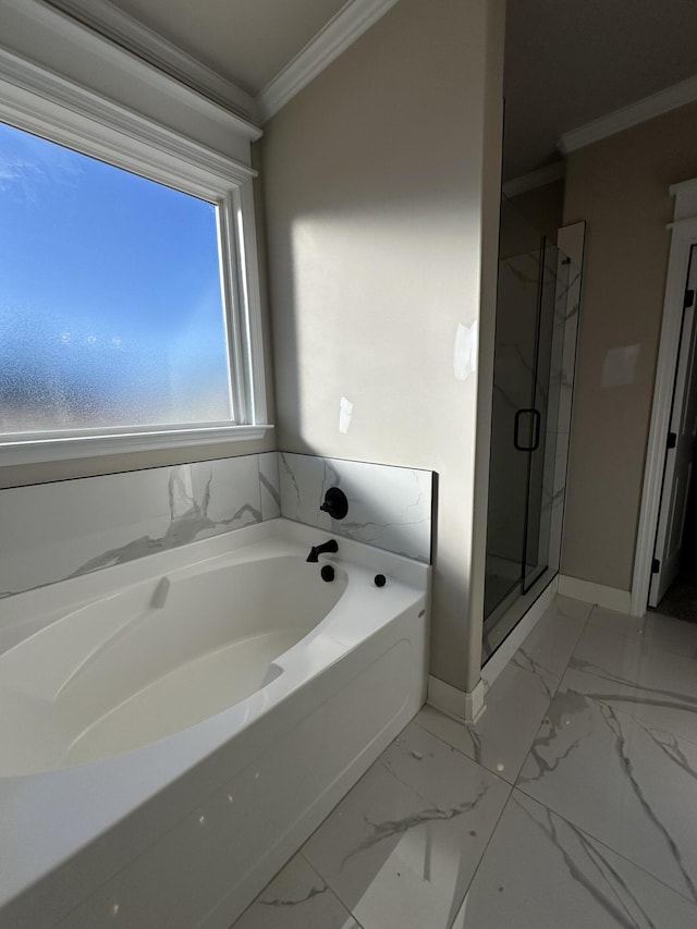 bathroom featuring crown molding and shower with separate bathtub