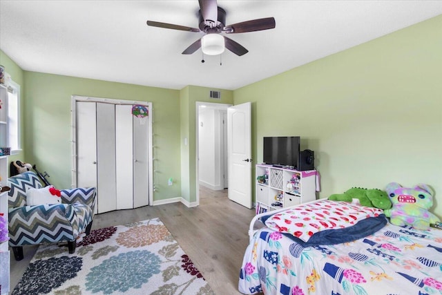 2726 Cardigan Ct, Hephzibah, GA 30815 - bedroom featuring wood finished floors, baseboards, ceiling fan, and a closet