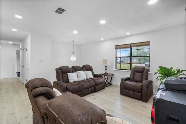 2726 Cardigan Ct, Hephzibah, GA 30815 - living room featuring light wood finished floors, recessed lighting, and baseboards