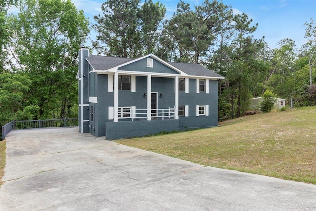 2726 Cardigan Ct, Hephzibah, GA 30815 - bi-level home with a chimney, driveway, a front lawn, and covered porch