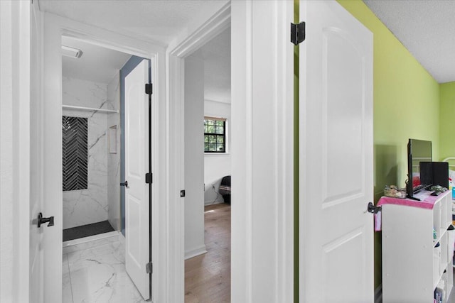 2726 Cardigan Ct, Hephzibah, GA 30815 - hallway featuring marble finish floors and baseboards
