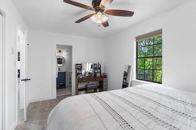2726 Cardigan Ct, Hephzibah, GA 30815 - bedroom featuring wood finished floors, a ceiling fan, baseboards, and ensuite bathroom