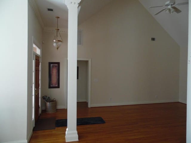 additional living space featuring ceiling fan, light wood finished floors, ornate columns, high vaulted ceiling, and baseboards