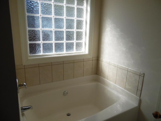 bathroom featuring a tub to relax in