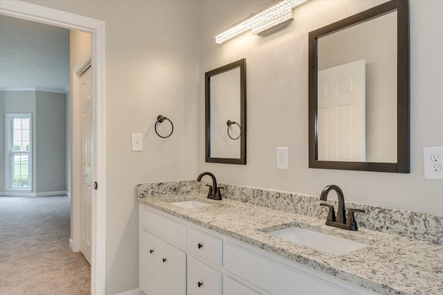 bathroom with vanity and ornamental molding