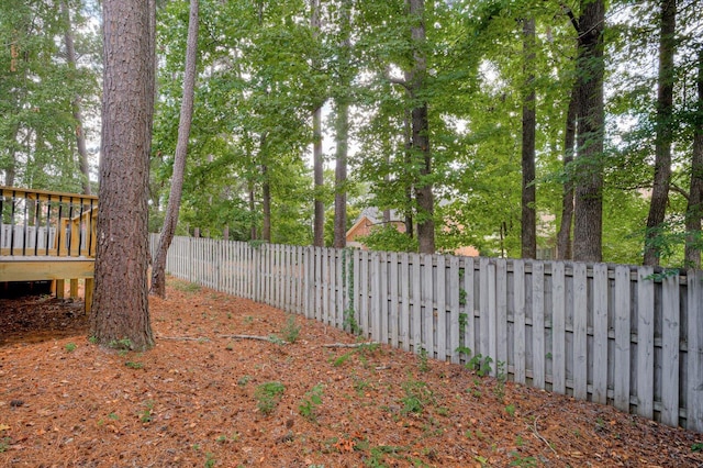 view of yard with a wooden deck