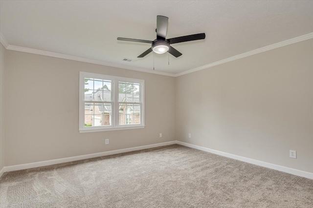 carpeted empty room featuring ceiling fan and ornamental molding