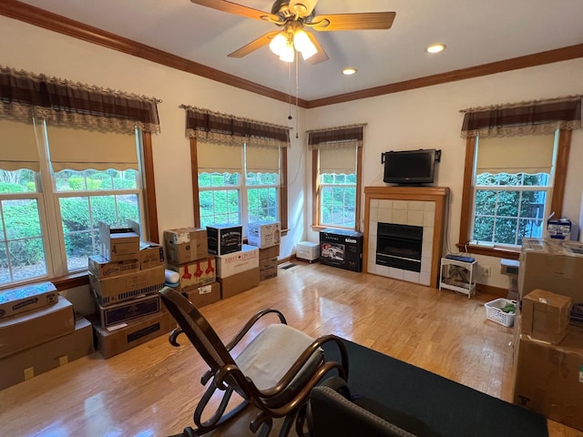139 Cresent Dr, Mccormick, SC 29835 - living room featuring wood finished floors, a ceiling fan, crown molding, a fireplace, and recessed lighting
