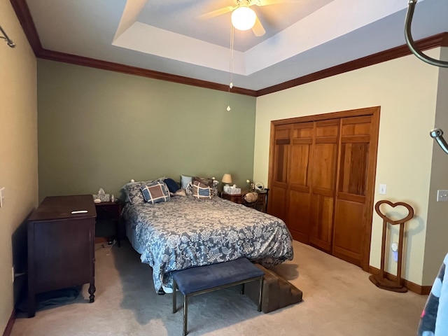 139 Cresent Dr, Mccormick, SC 29835 - bedroom featuring light colored carpet, a closet, crown molding, ceiling fan, and a raised ceiling