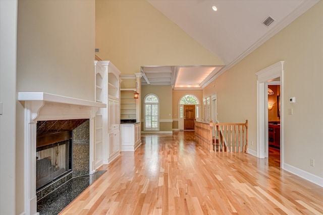 12 Shadowbrook Cir, Augusta, GA 30909 - unfurnished living room with a premium fireplace, light wood finished floors, baseboards, high vaulted ceiling, and crown molding