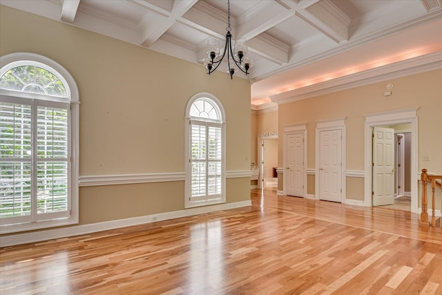 12 Shadowbrook Cir, Augusta, GA 30909 - spare room featuring light wood-style flooring, a chandelier, beam ceiling, coffered ceiling, and ornamental molding