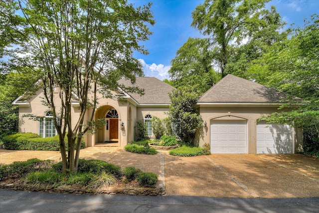 12 Shadowbrook Cir, Augusta, GA 30909 - view of front of house featuring stucco siding, concrete driveway, a garage, and a shingled roof
