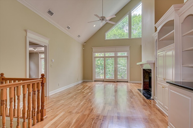 12 Shadowbrook Cir, Augusta, GA 30909 - unfurnished living room with ceiling fan, light wood finished floors, a high end fireplace, plenty of natural light, and high vaulted ceiling