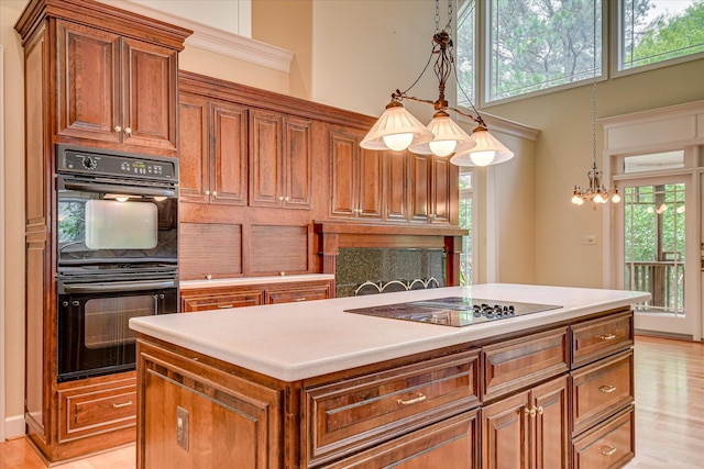 12 Shadowbrook Cir, Augusta, GA 30909 - kitchen with black appliances, brown cabinets, plenty of natural light, and a towering ceiling