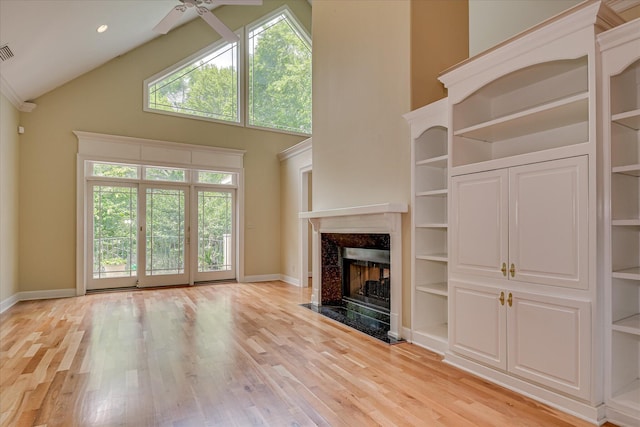 12 Shadowbrook Cir, Augusta, GA 30909 - unfurnished living room with a ceiling fan, high vaulted ceiling, a high end fireplace, baseboards, and light wood-style flooring