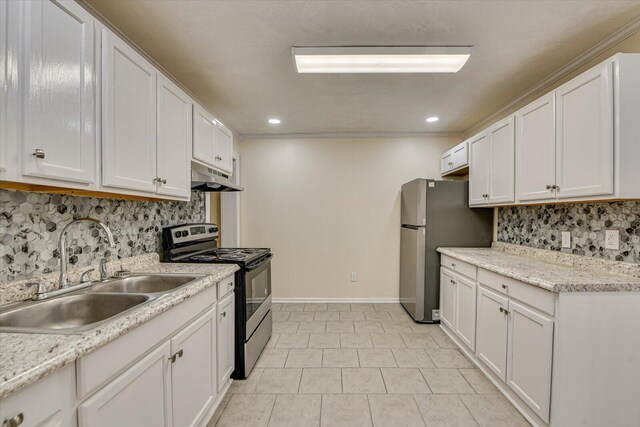 kitchen with under cabinet range hood, stainless steel appliances, a sink, tasteful backsplash, and white cabinetry