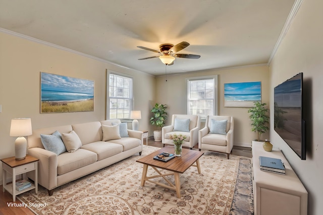 living room featuring crown molding, a healthy amount of sunlight, light wood finished floors, and ceiling fan