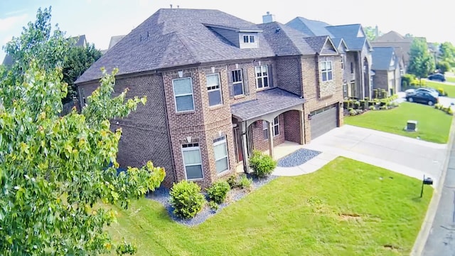 343 Abby Cir, Greenville, SC 29607 - view of front of house featuring brick siding, concrete driveway, a garage, a front yard, and a chimney