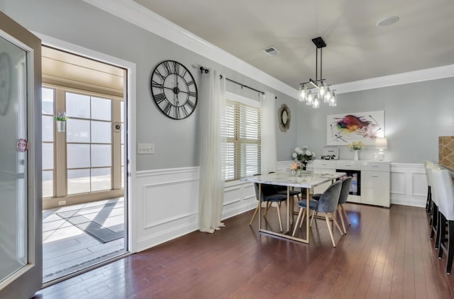 343 Abby Cir, Greenville, SC 29607 - dining room featuring wainscoting, ornamental molding, dark wood-type flooring, and a decorative wall