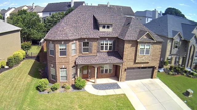 343 Abby Cir, Greenville, SC 29607 - view of front facade featuring brick siding, a garage, a residential view, and driveway