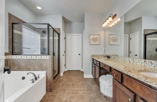 343 Abby Cir, Greenville, SC 29607 - bathroom featuring a stall shower, a garden tub, double vanity, and baseboards