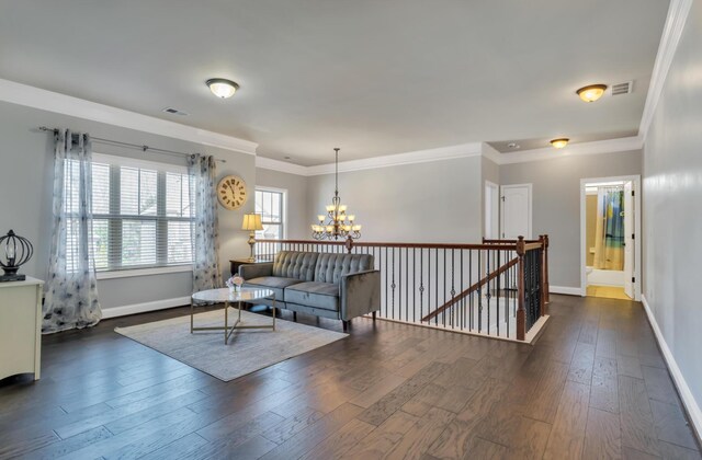 343 Abby Cir, Greenville, SC 29607 - living area featuring a chandelier, baseboards, dark wood-type flooring, and crown molding