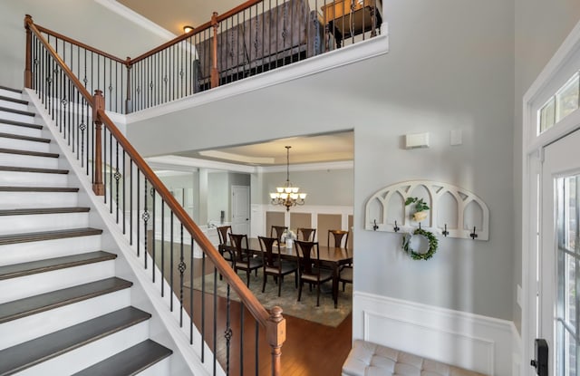 343 Abby Cir, Greenville, SC 29607 - staircase featuring a high ceiling, wood finished floors, and a chandelier