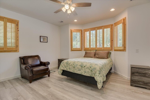 bedroom featuring wood finished floors, baseboards, recessed lighting, and a ceiling fan