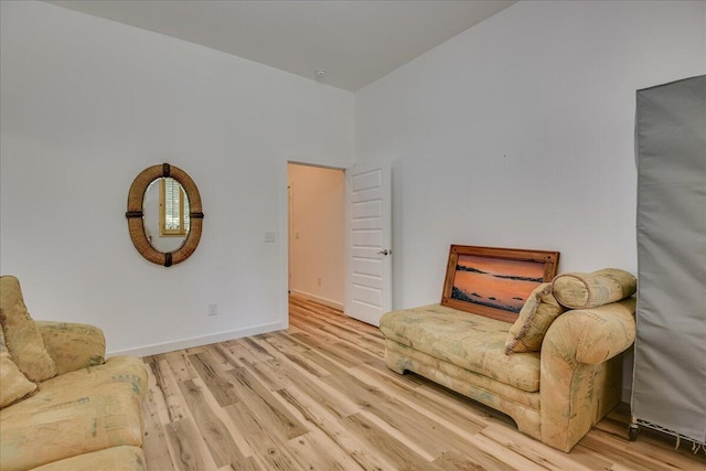 sitting room with wood finished floors and baseboards
