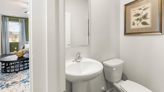 bathroom featuring toilet and sink