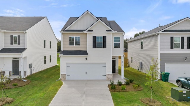 view of front of house with a garage and a front lawn