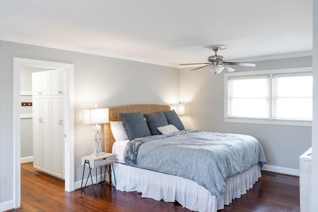 bedroom with dark wood-type flooring, ceiling fan, and ornamental molding