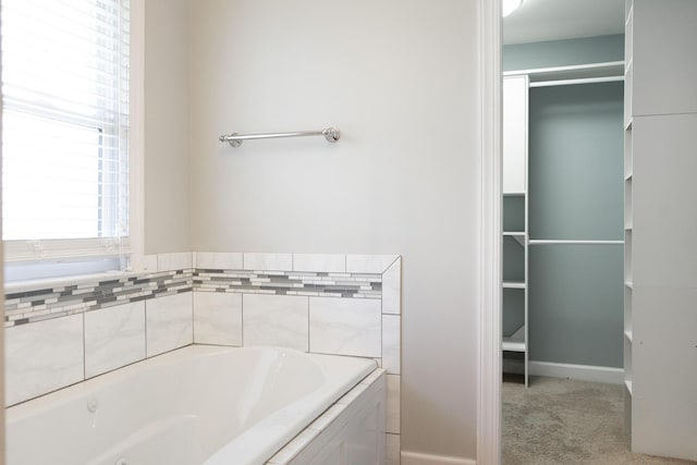 bathroom featuring a tub to relax in