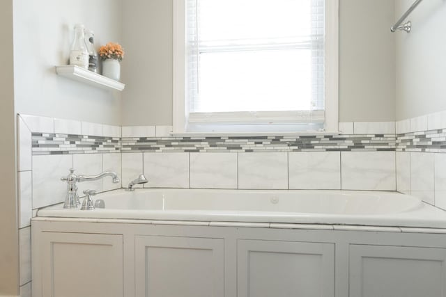 bathroom with a tub