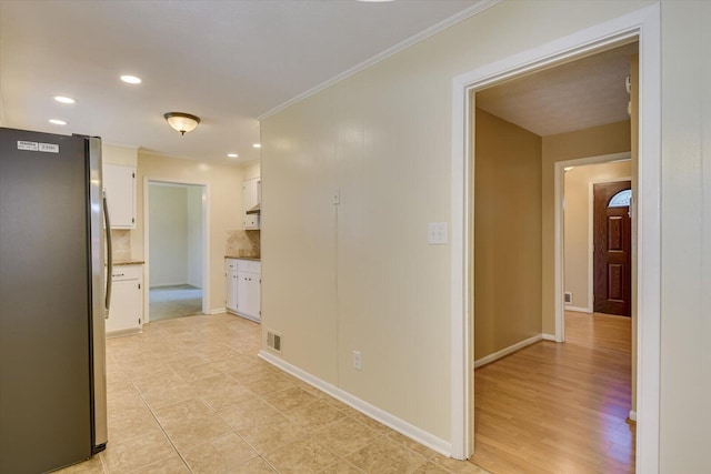 hallway with crown molding