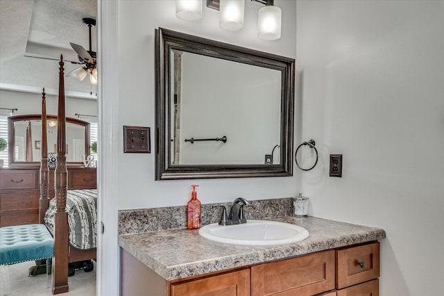 ensuite bathroom featuring vanity, a ceiling fan, and connected bathroom