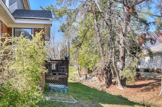 view of yard with a wooden deck