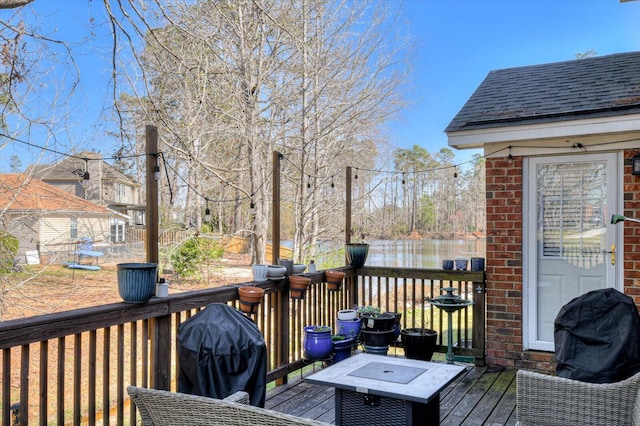 wooden deck with area for grilling