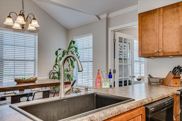 kitchen featuring a notable chandelier, pendant lighting, a sink, black dishwasher, and brown cabinetry