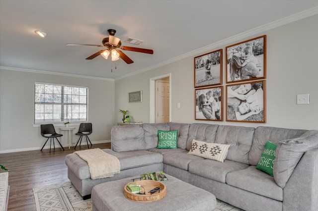 living area with visible vents, baseboards, ceiling fan, ornamental molding, and wood finished floors