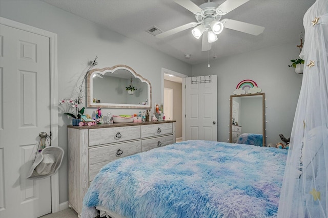 bedroom with visible vents and ceiling fan