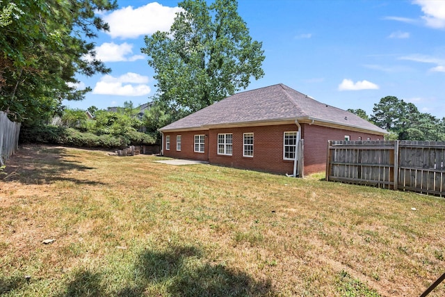 2042 Silver Run Fls, Grovetown, GA 30813 - view of home's exterior with brick siding, a fenced backyard, and a patio