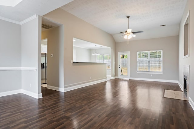 2042 Silver Run Fls, Grovetown, GA 30813 - unfurnished living room featuring a ceiling fan, dark wood-type flooring, a chandelier, a fireplace with flush hearth, and vaulted ceiling