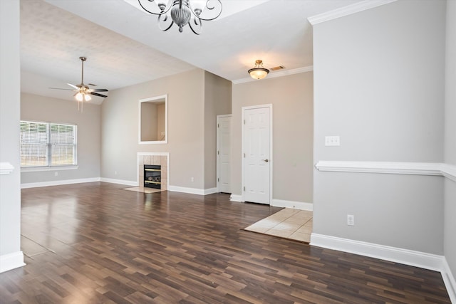 2042 Silver Run Fls, Grovetown, GA 30813 - unfurnished living room featuring a chandelier, wood finished floors, a tiled fireplace, and ceiling fan