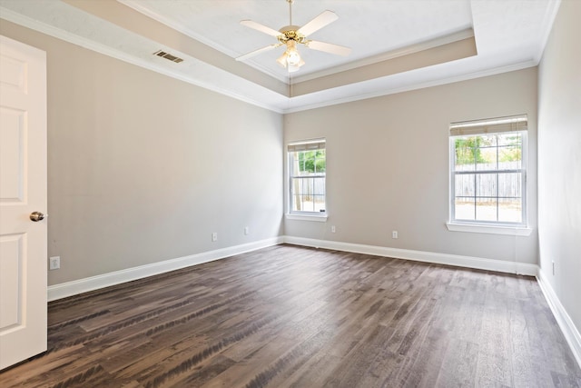 2042 Silver Run Fls, Grovetown, GA 30813 - spare room with dark wood-style flooring, plenty of natural light, a raised ceiling, and crown molding